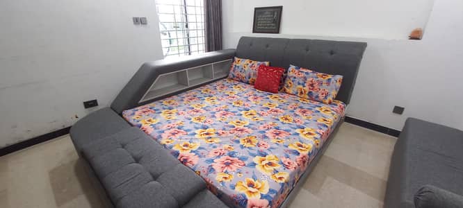 Bed with bookshelf and storage box