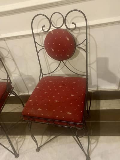 Pair of iron wrought chairs in good condition