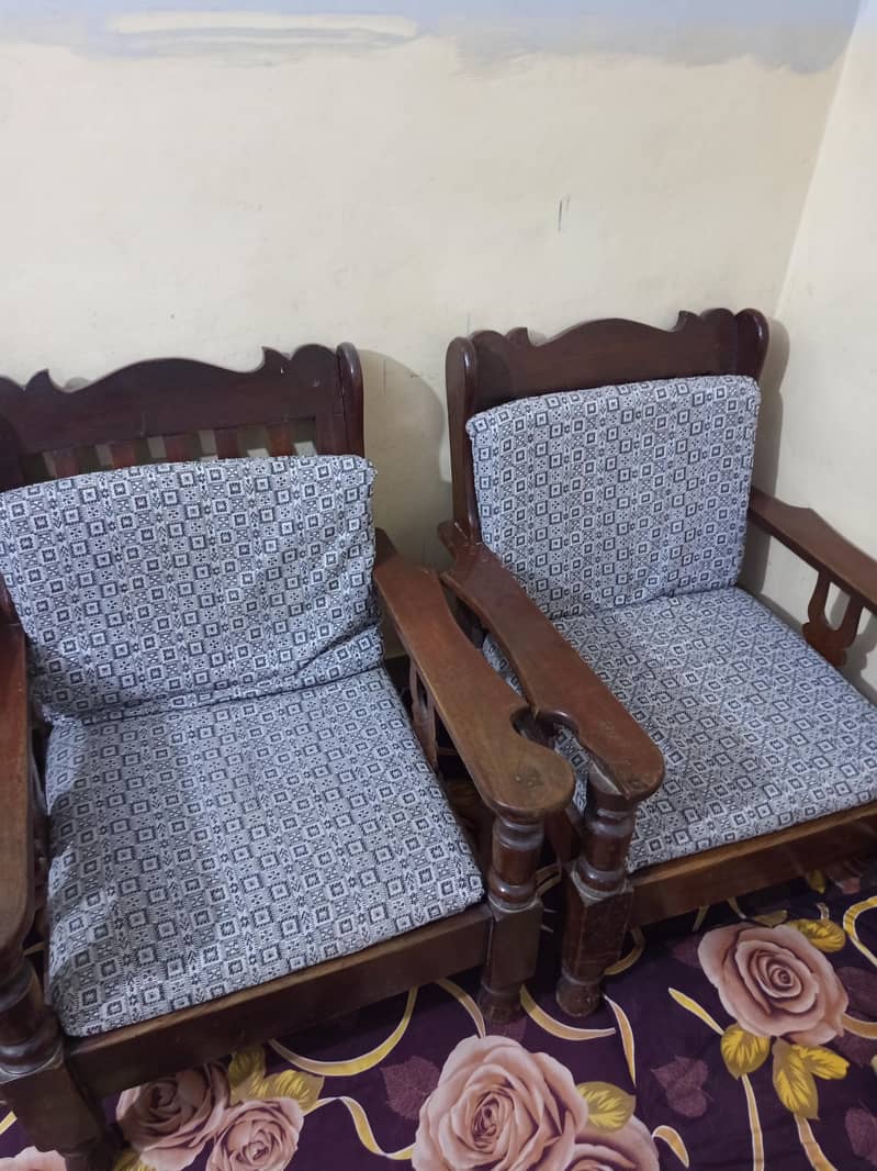 2 Wood sofas and a table 0