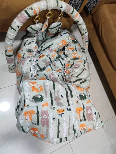 cute baby bed with comforter and pillows