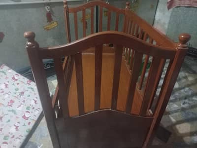 Slightly used baby cot with  mattress