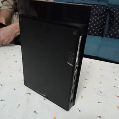 PS3 slim with original sony controller and 5 games discs.