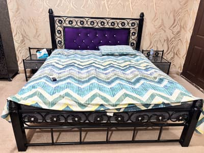 Iron bed with mattress and side table and dressing table
