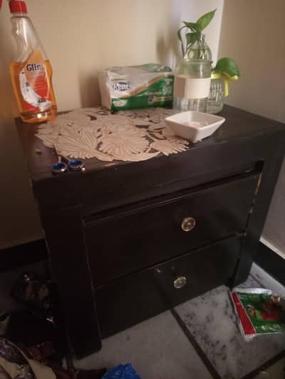 single bed along with mattress and side table