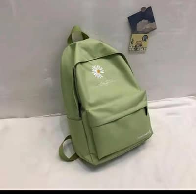 Multicolour daisy print nyllon bagpack. WhatsApp: 0319-6239820 Rs. 2000