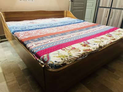 King size bed with master molty foam matress and 2 side tables.
