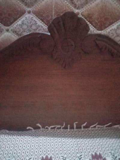 Two single wooden beds