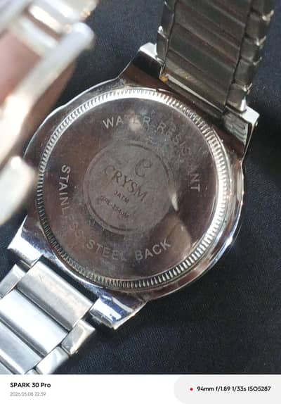 CRYSMA COMPANY WATER RESISTANT. STAINLESS STEEL BACK