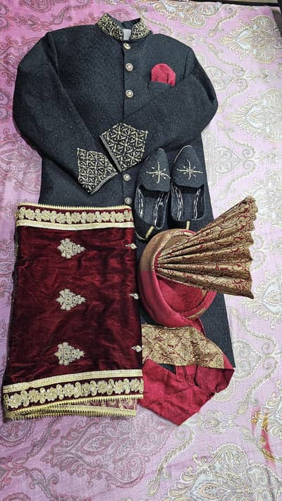 Jet black groom sherwani