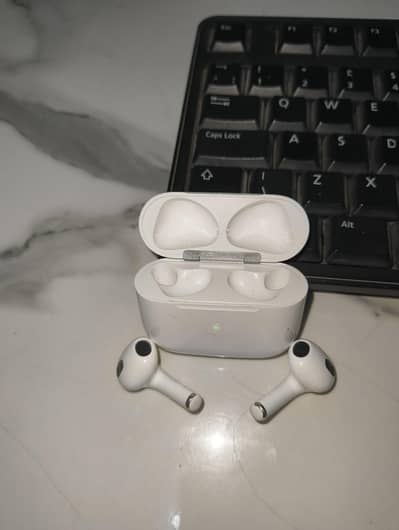 Apple AirPods (3rd Generation) with a Lightning charging case.