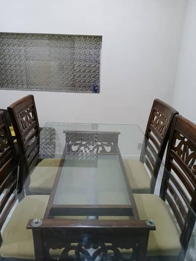 Eid Gatherings Special with this Elegant Glass-Top Dining Set! 