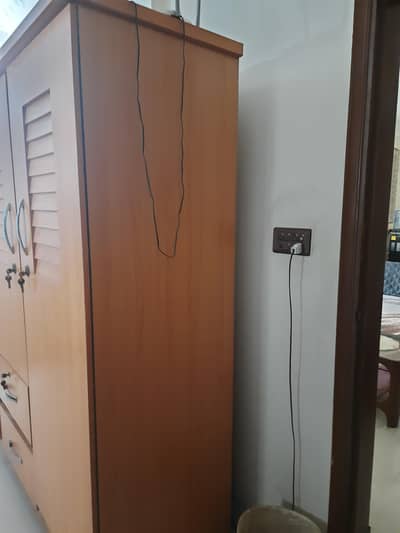 2 wooden wardrobes, with three partitions 6 feet by 6 feet by 3 feet .