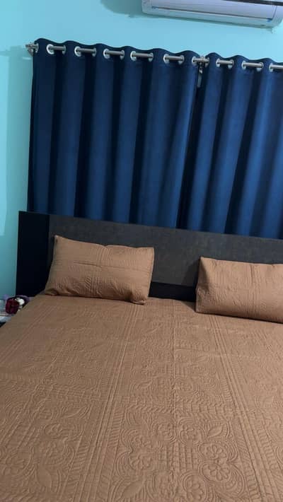King size bed with attached side tables