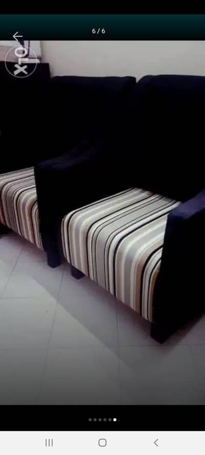 a pair of fully covered single seater sofa