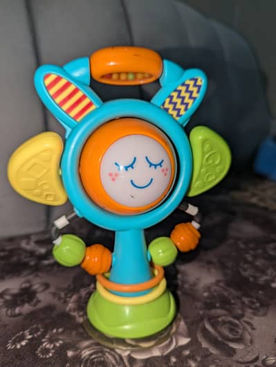 Hap-P-Kid Little Learner Sun N' Glow High Chair toy.