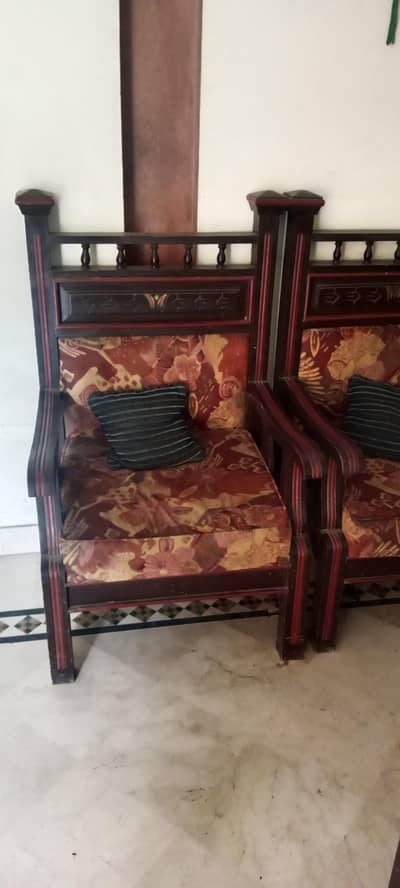 one large and  two single sofas wooden