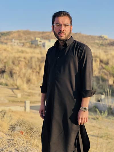 Kami Khan  