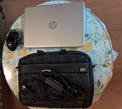 HP-laptop with bag, charger, mouse.