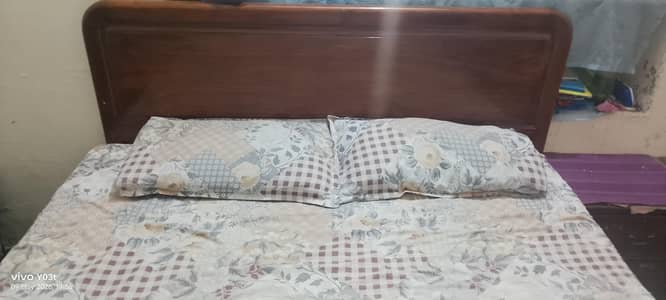 Wooden bed set with mattress.