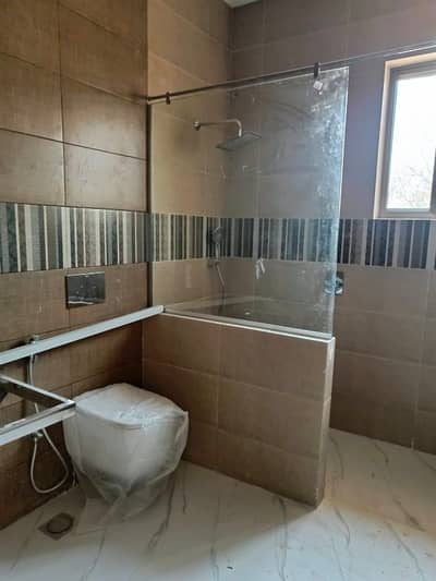 F-11 Brand New Ground Floor Excellent Proper Tiled Floor 700 SQY Proper 3 bedrooms 3 Attached Bathrooms Drawing Dining. TV lounge, Kitchen Beautiful Lawn, Parking 4 Cars, Servant Quarter