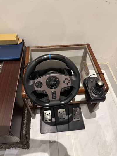 Xbox steering wheel and headphones