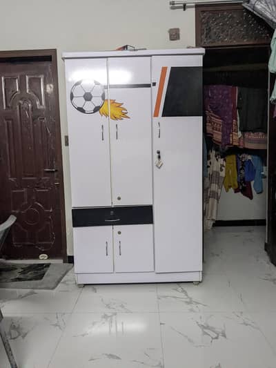 white coloured Bed and Cupboard
