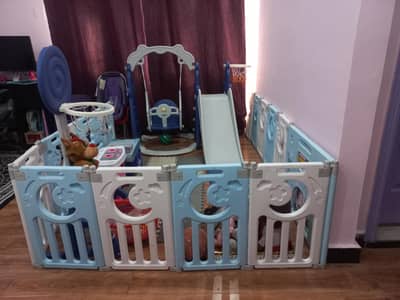 slide and swing 5 in 1 snug and play toy amd boundry play pen