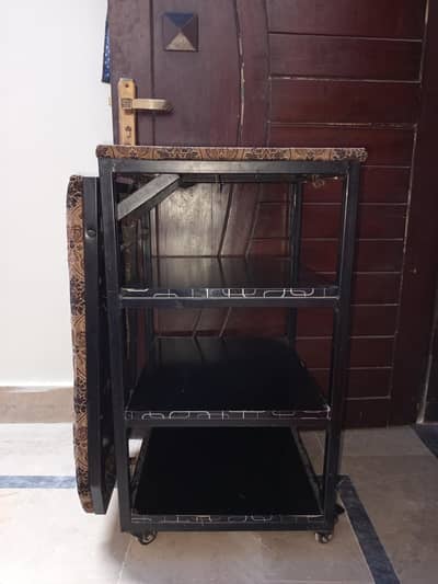 iron stand with shelf.