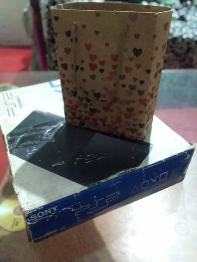 PLAY STATION 2 ALL OK 10/10.  CONDITionwith new wireless remote L