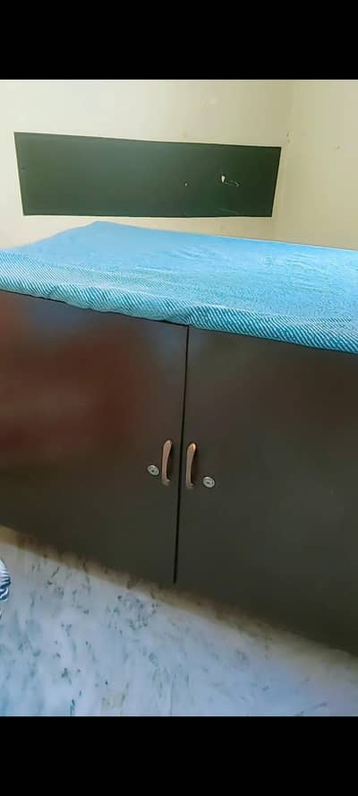 Iron Table + large storage capacity cupboard.