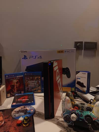 Sony PS4 slim 1TB | 4 games | charging dock | Excellent condition