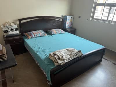 Wooden bed with metres