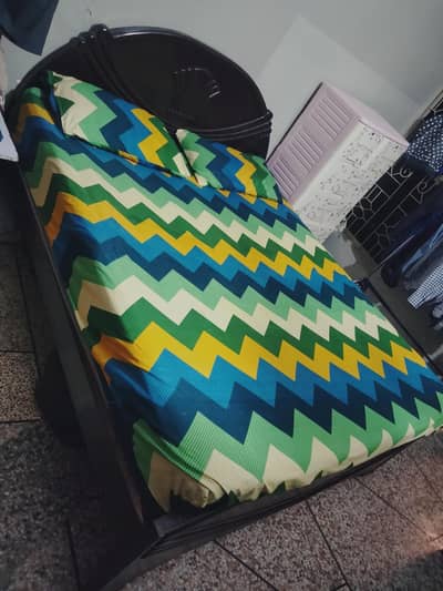 Bed with spring mattress and Showcase