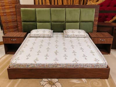low profile wooden bed with two side tables
