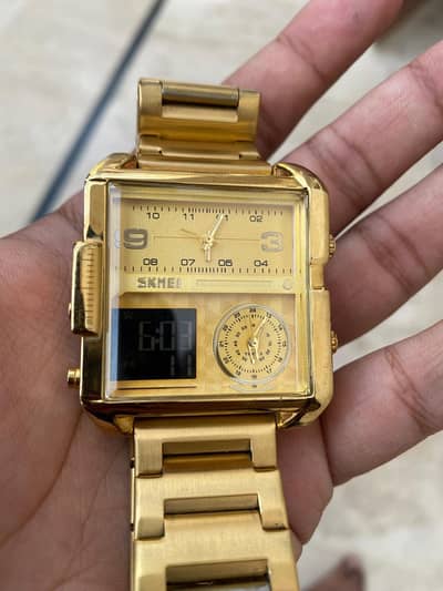 gold-colored SKMEI 1584 Triple Time Watch.