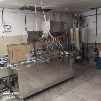Liquid filler with tanks and R. O plant