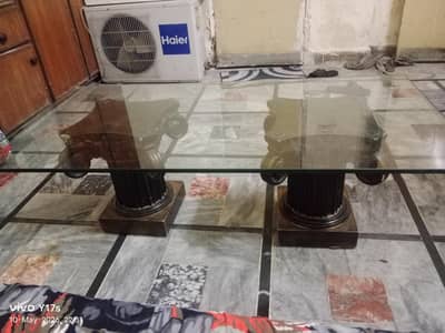 Wooden table with glass for sale