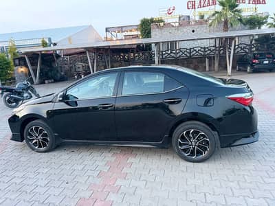 toyata altis grande 1.8 black with black interior