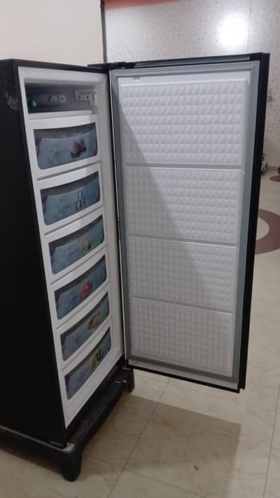 dawlance vertical frezzer no issue 10 by 10 condition 24 days used