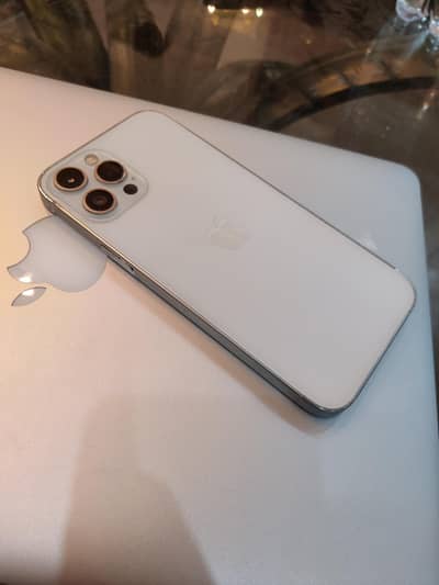 I phone 12 pro max factory unlock 128 gb . . face id ok. true ton ON