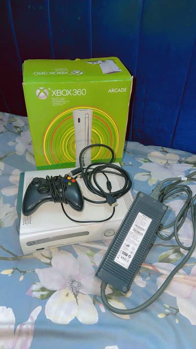 Xbox 360 console  with black colour wire controller. .