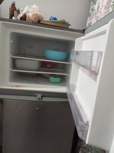 HAIER home fridge for sale 4 years used never opened or. repaired
