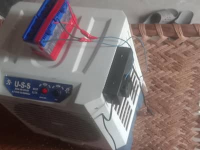 baby air cooler and 2 battery.  AC. DC. air cooler. nomber 03066086662