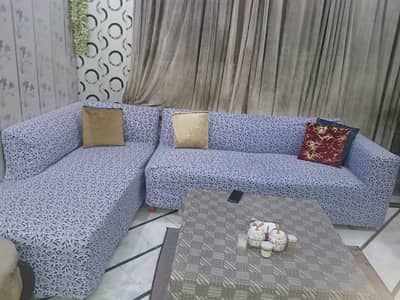 L-shaped sofa with stitched covers