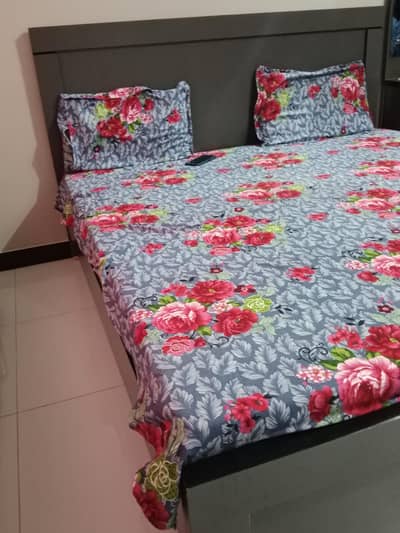 a beautiful bed along dressing table