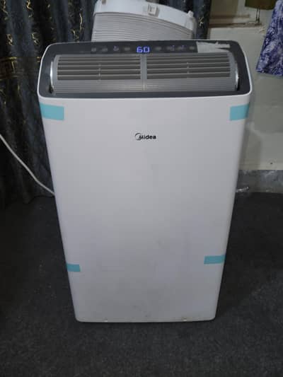 Midea Portable AC 1.25 ton with Low Electricity Consumption. Almost new