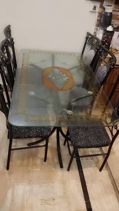 Glass dining table  with 6 iron chairs