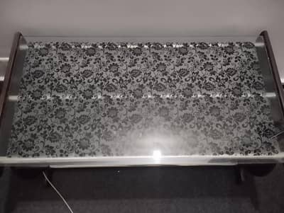 excellent design on glass coffee/central table for sale