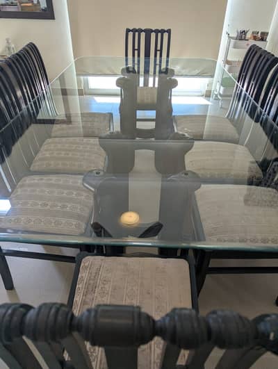 Upgrade your dining space with this stylish rectangular glass-top tab