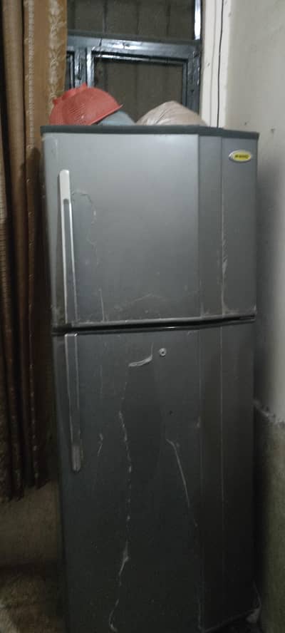 fridge for sale reason able price plz serous customer call or msg me